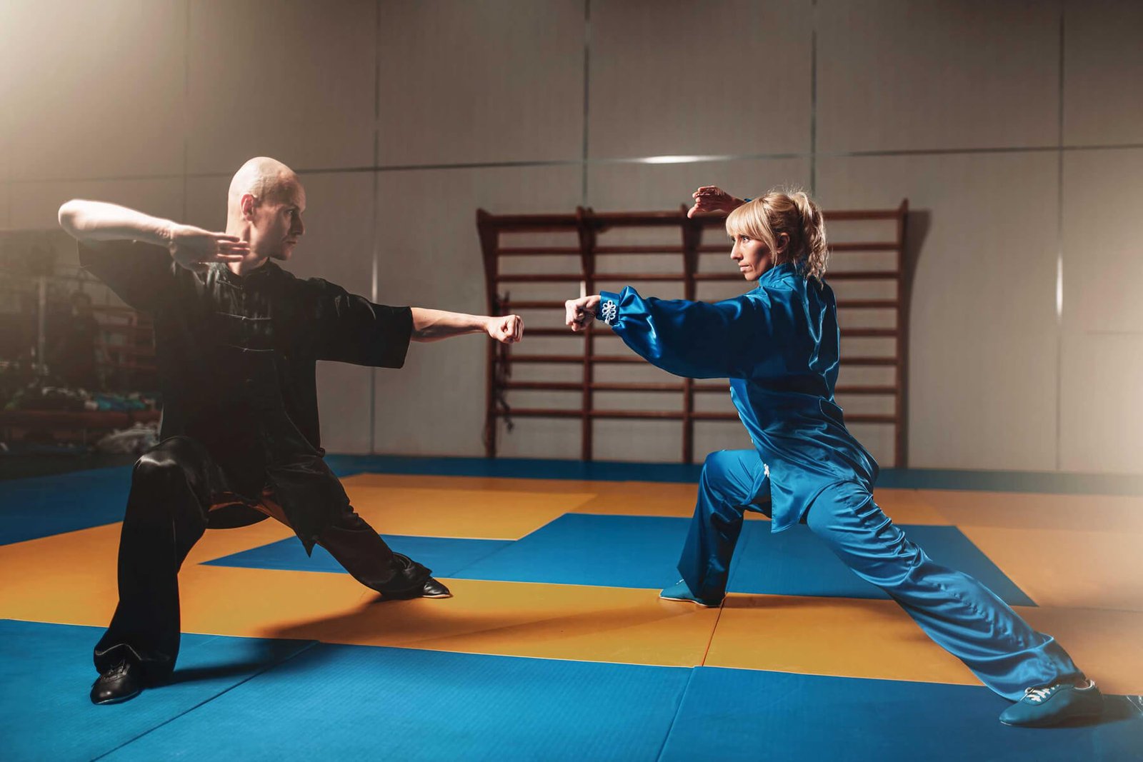 male-and-female-wushu-fighters-exercises-indoor-PKT9LWX.jpg
